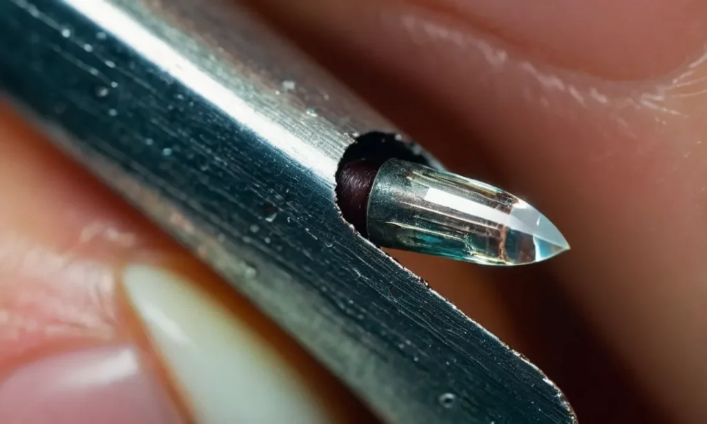 A close-up photo capturing a split nail, showing the clear division down the middle, revealing the layers of the nail plate and highlighting the issue of nail splitting.