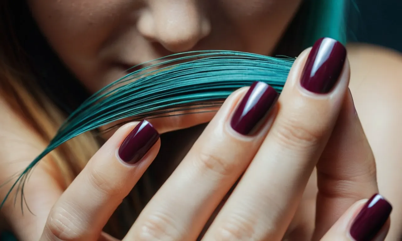A close-up photo capturing the intricate details of a hand, showcasing the contrasting textures of living skin, vibrant nails, and the flowing strands of hair, provoking curiosity about their living or nonliving nature.