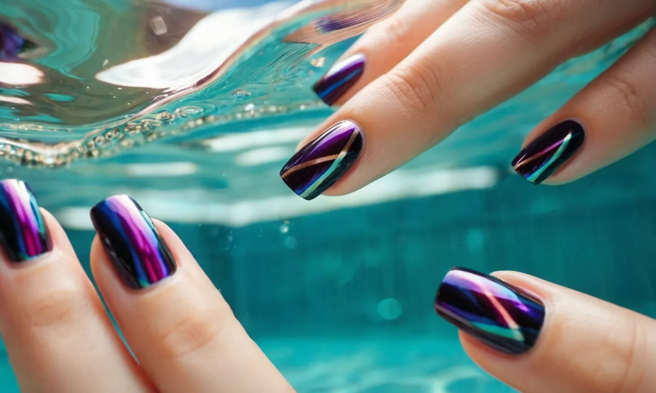 A close-up shot capturing a pair of vibrant press-on nails, delicately adorning a hand, while gently submerged in crystal-clear water within a serene pool.