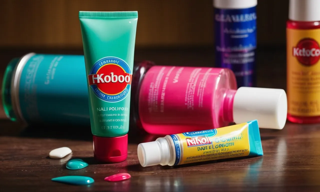 A close-up shot of a colorful toothpaste tube placed next to a bottle of nail polish, showcasing the curiosity surrounding the idea of toothpaste aiding nail growth.