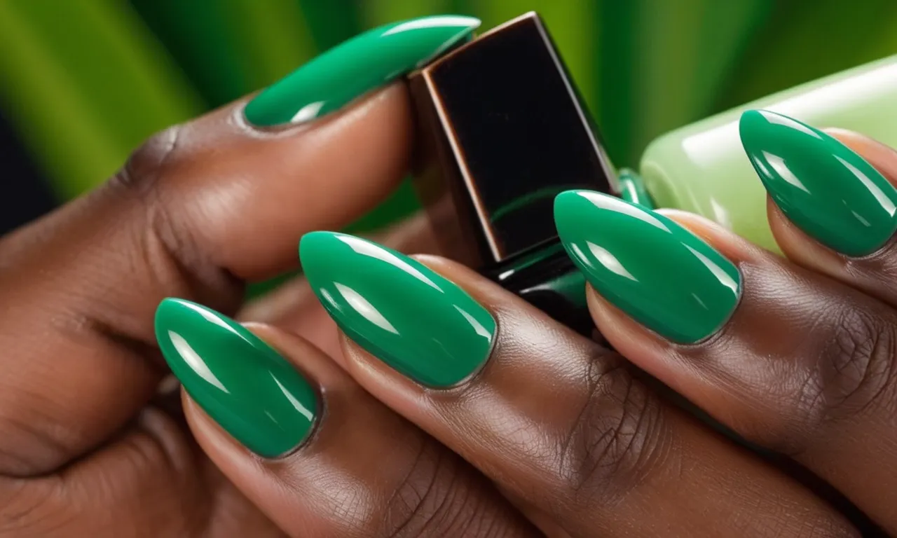 A close-up shot capturing the elegance of a hand with beautifully manicured green nails on the contrasting backdrop of smooth, glowing brown skin.