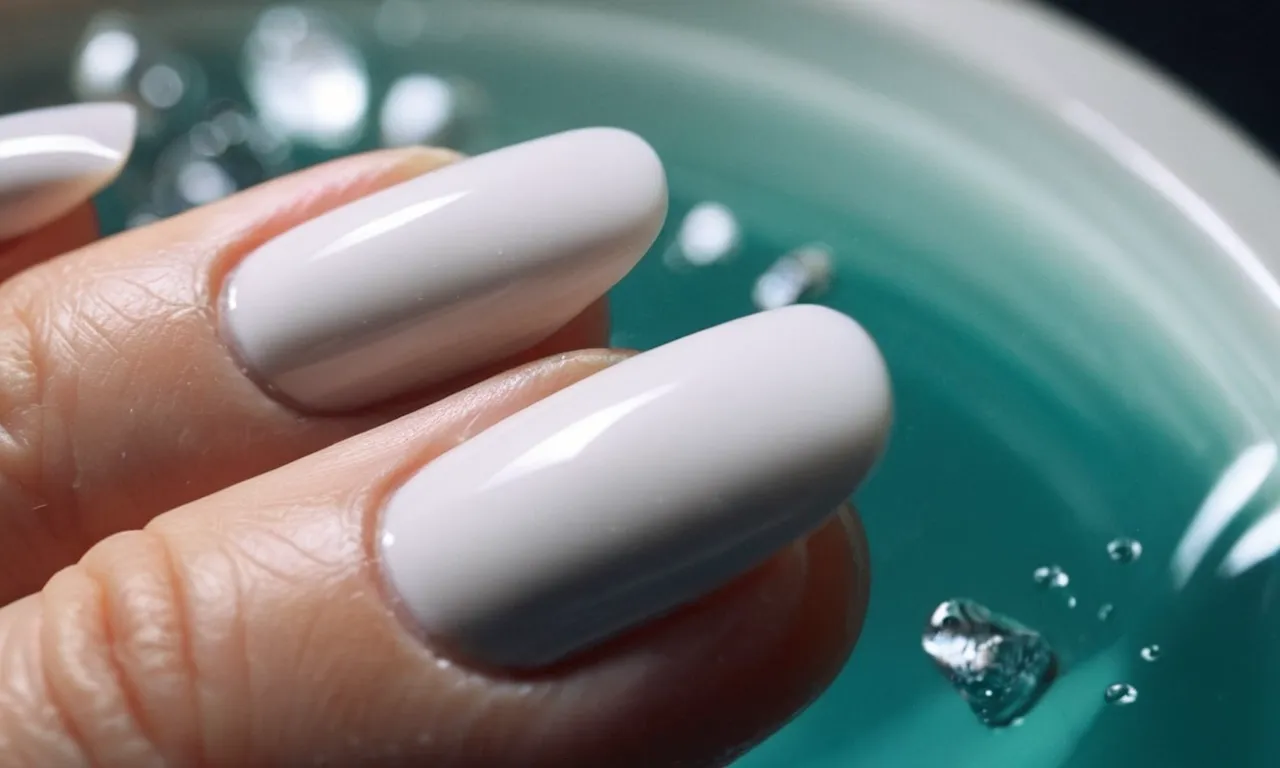 A close-up shot of a pair of white acrylic nails being gently scrubbed with a soft brush under running water, capturing the process of cleaning and restoring their pristine appearance.