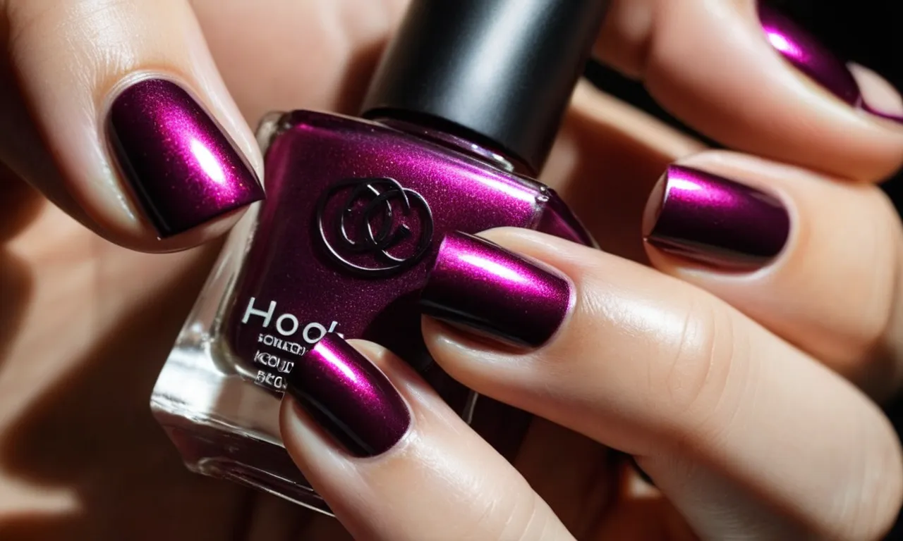 A close-up photo capturing a perfectly manicured hand, showcasing vibrant nail polish with a glossy finish, symbolizing long-lasting beauty and durability.