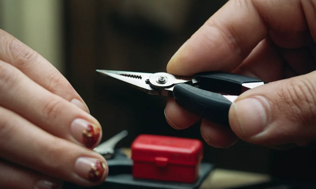 A close-up shot capturing a hand holding pliers, delicately grasping a stripped nail head, ready to twist and remove it with precision and determination.