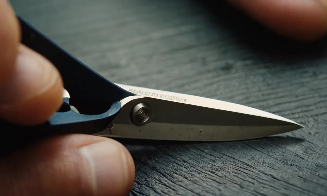 A close-up photo showcasing the intricate process of sharpening a pair of scissors using a nail file, capturing the precision and detail required for achieving a sharp cutting edge.
